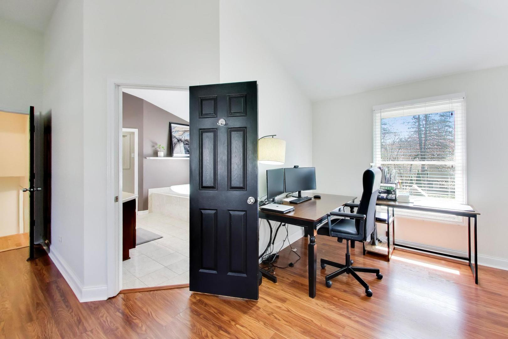 44 Swift Lane Naperville, IL 60565 - Photo 26 of 37 a workspace with furniture hardwood and a window