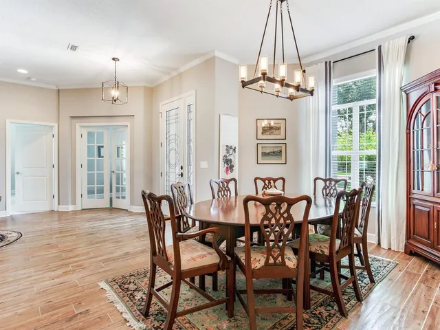 a dining room with furniture and window