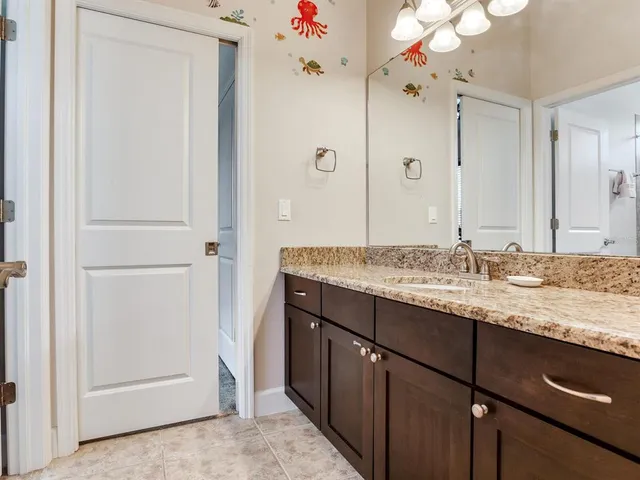 a front view of a house with a garden and a yard