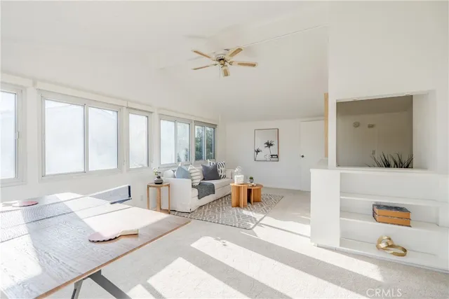 a living room with furniture and window