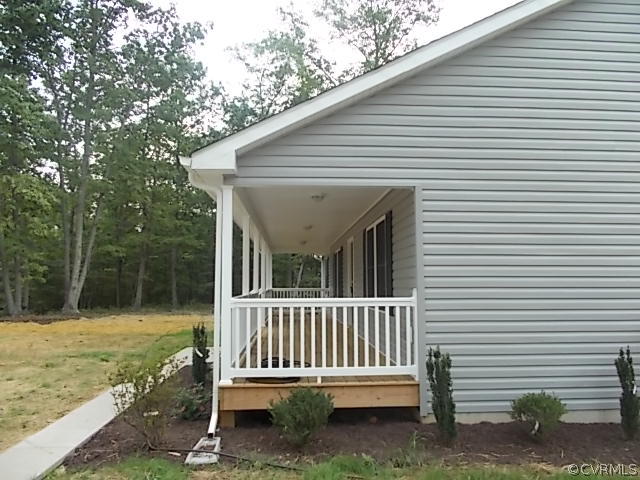 102 Jacoby Road Louisa, VA 23093 - Photo 18 of 24 a view of a house with backyard and a garden