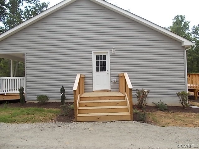 102 Jacoby Road Louisa, VA 23093 - Photo 19 of 24 a view of a house with a yard and wooden fence