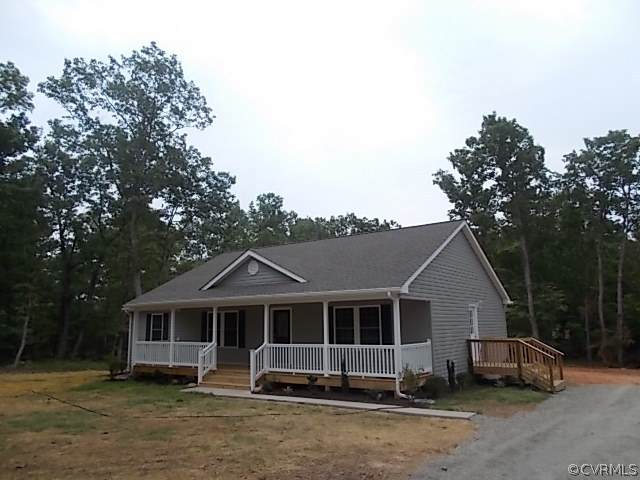 102 Jacoby Road Louisa, VA 23093 - Photo 2 of 24 a front view of a house with a garden
