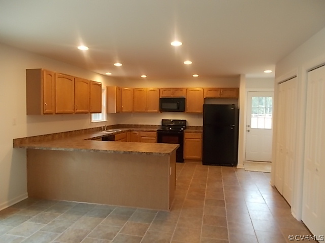 102 Jacoby Road Louisa, VA 23093 - Photo 3 of 24 a kitchen with stainless steel appliances granite countertop a refrigerator and a stove