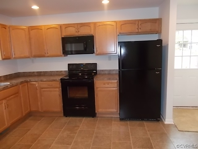 102 Jacoby Road Louisa, VA 23093 - Photo 5 of 24 a kitchen with a refrigerator and a stove