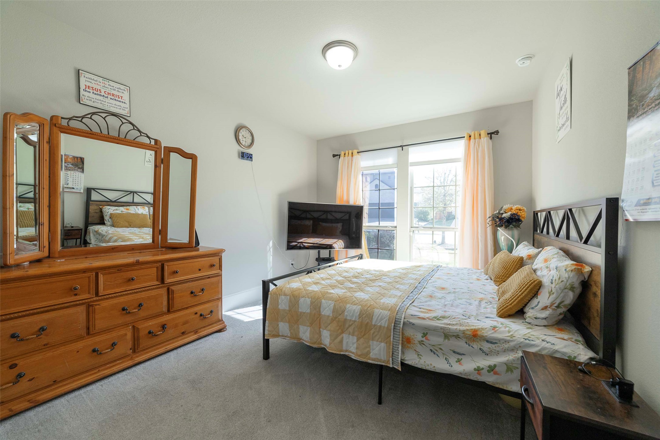 17821 Limestone Spring Lane Austin, TX 78738 - Photo 23 of 40 a bedroom with a bed and a fireplace