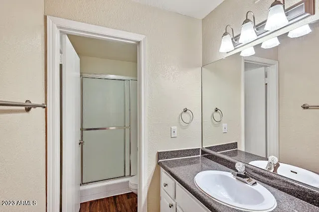 a bathroom with a sink double vanity and a mirror