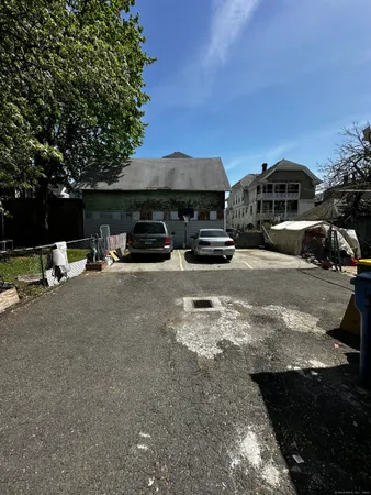 a view of street with parked cars