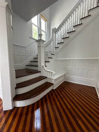 a view of entryway with wooden floor
