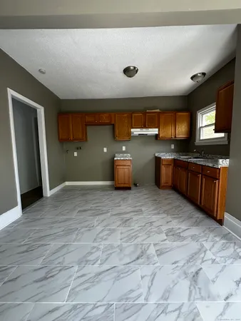 a room with a bed and a television