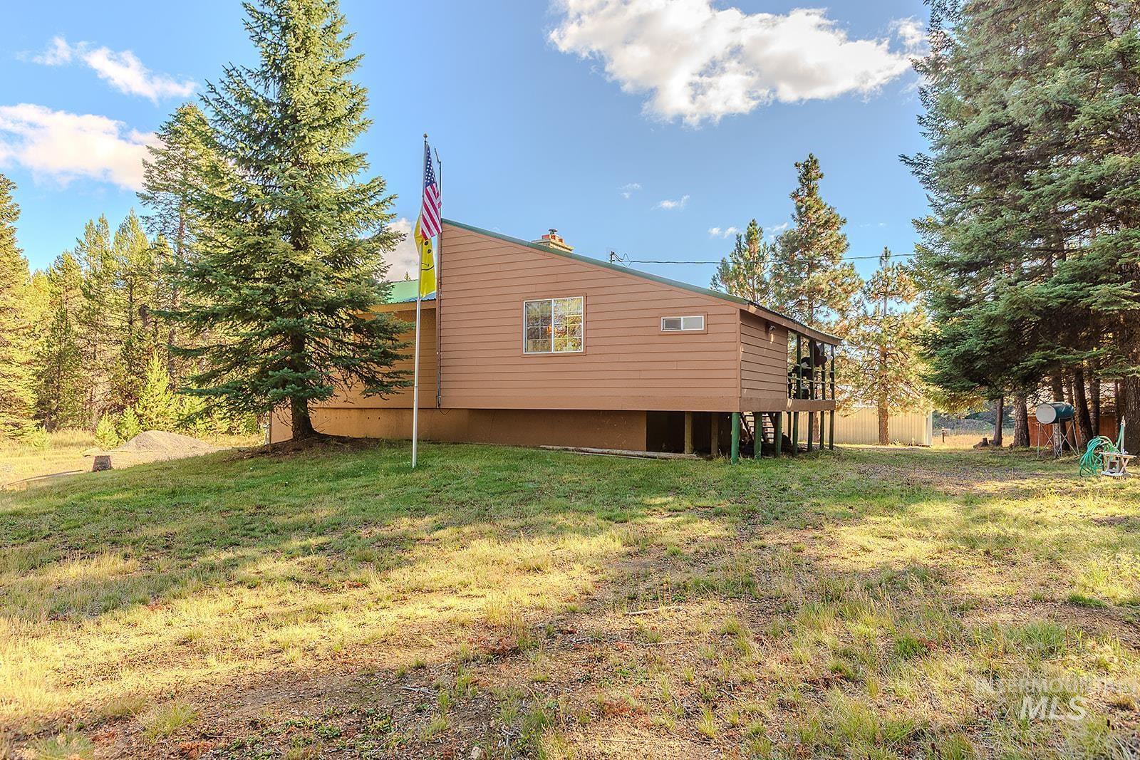 25314 Soldiers Meadow Road Winchester, ID 83555 - Photo 5 of 45 View of side of property featuring a yard and stairway