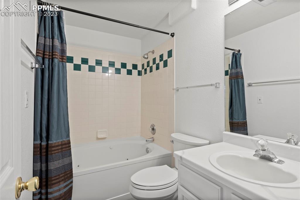 11916 Bonifay Loop Peyton, CO 80831 - Photo 29 of 42 a bathroom with a sink toilet and shower