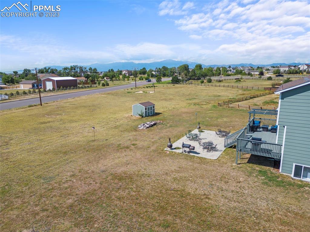 11916 Bonifay Loop Peyton, CO 80831 - Photo 33 of 42 a terrace with outdoor seating and city view
