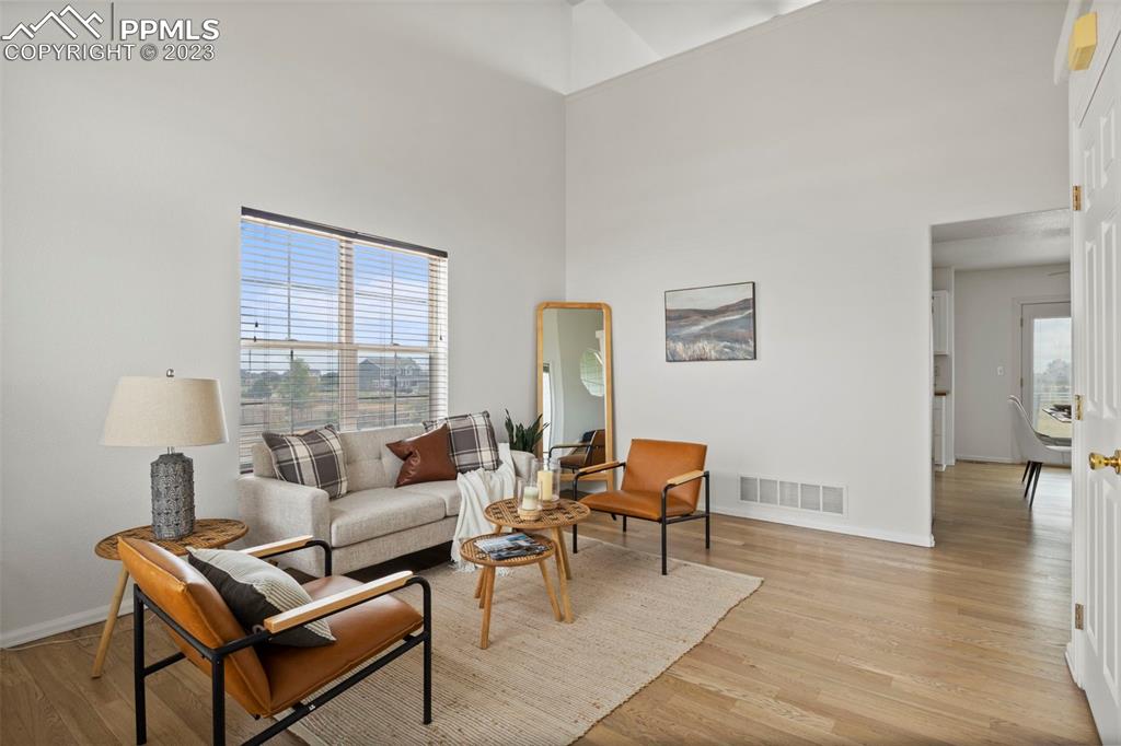 11916 Bonifay Loop Peyton, CO 80831 - Photo 5 of 42 a living room with furniture and a table