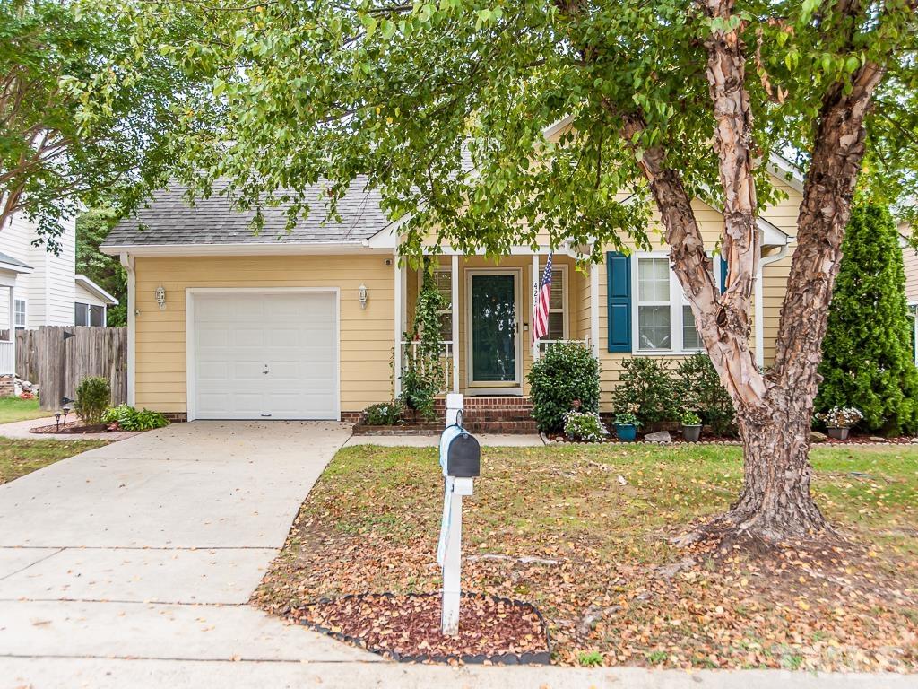 4217 Mardela Spring Drive Raleigh, NC 27616 - Photo 1 of 26 a front view of a house with yard