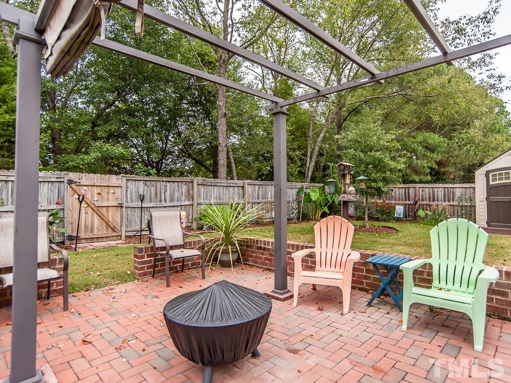 4217 Mardela Spring Drive Raleigh, NC 27616 - Photo 3 of 26 a view of a chair and tables in the patio