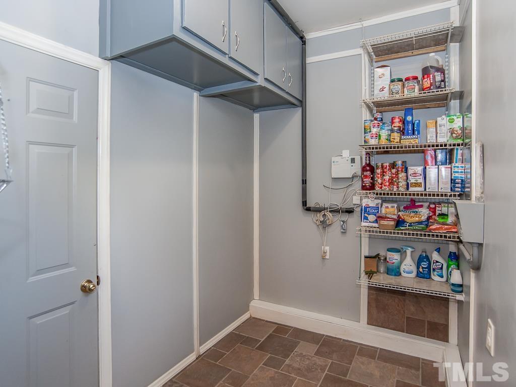 4217 Mardela Spring Drive Raleigh, NC 27616 - Photo 24 of 26 a view of storage and utility room with cabinet and closet