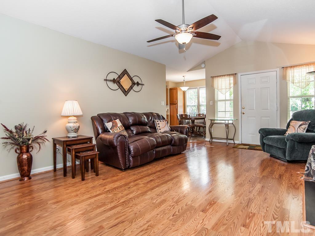4217 Mardela Spring Drive Raleigh, NC 27616 - Photo 8 of 26 a living room with furniture and a large window