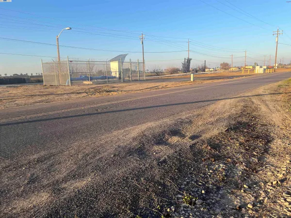 a view of a room stove and kitchen view
