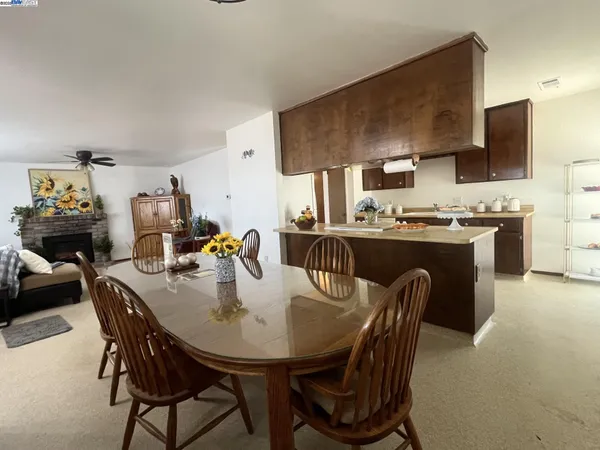 a dining room with furniture and window