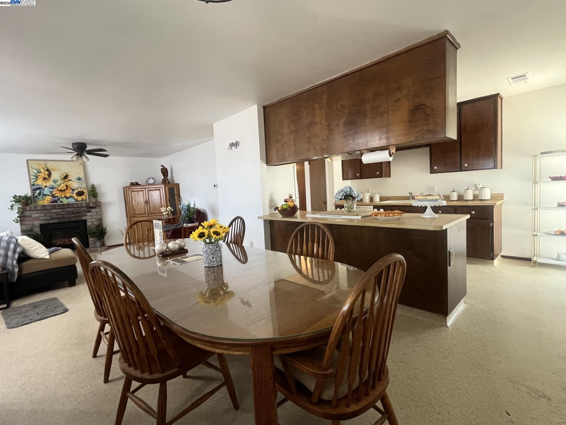 1290 Orange Avenue Patterson, CA 95363 - Photo 5 of 36 a dining room with furniture and window