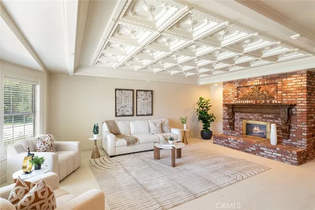 a view of a dining room with furniture and a chandelier
