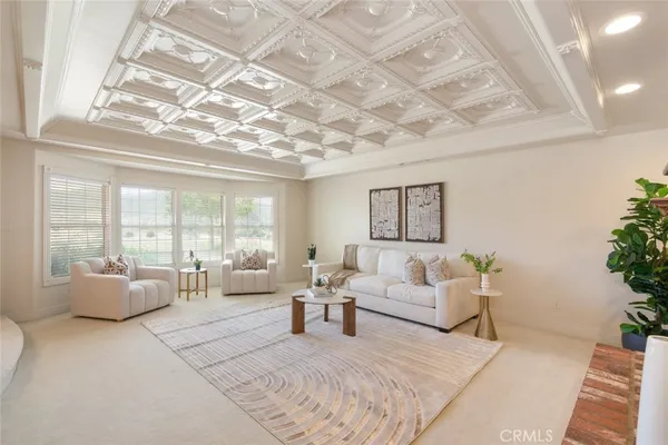 a kitchen with kitchen island granite countertop a stove and a sink