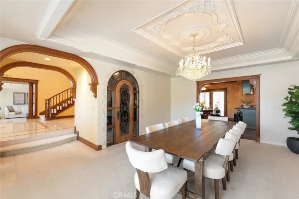 a bedroom with furniture and a large window