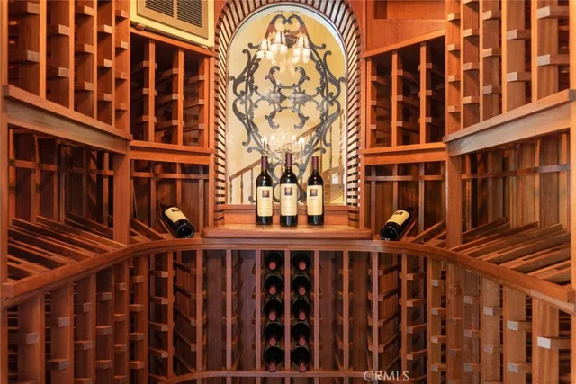 a bedroom with furniture and a large window