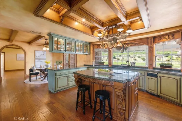 a living room with furniture and a ceiling fan