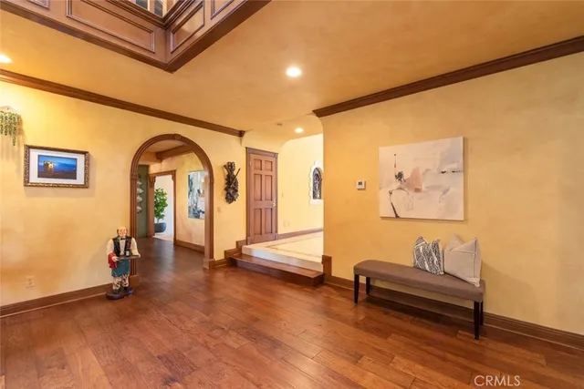 a spacious en suite bathroom with a tub and window