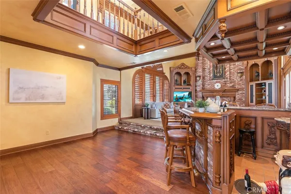 a spacious en suite bathroom with a tub and window