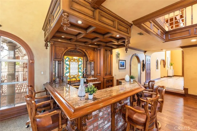 a spacious bedroom with a bed and a large window