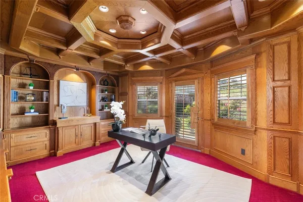 a spacious bedroom with a bed and a large window