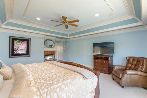 an aerial view of residential house with outdoor space and trees all around