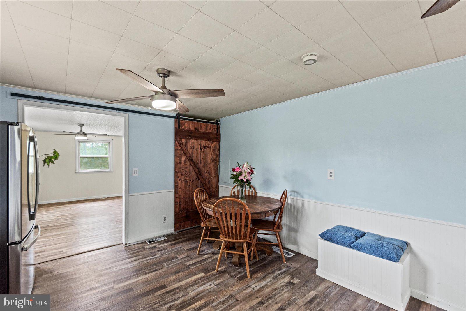 679 Resettlement Road Madison, VA 22727 - Photo 11 of 47 a dining room with furniture and window