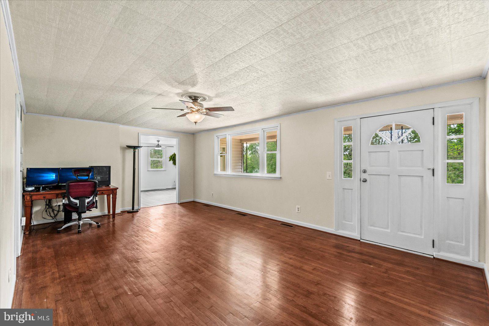 679 Resettlement Road Madison, VA 22727 - Photo 15 of 47 wooden floor in an empty room with a window