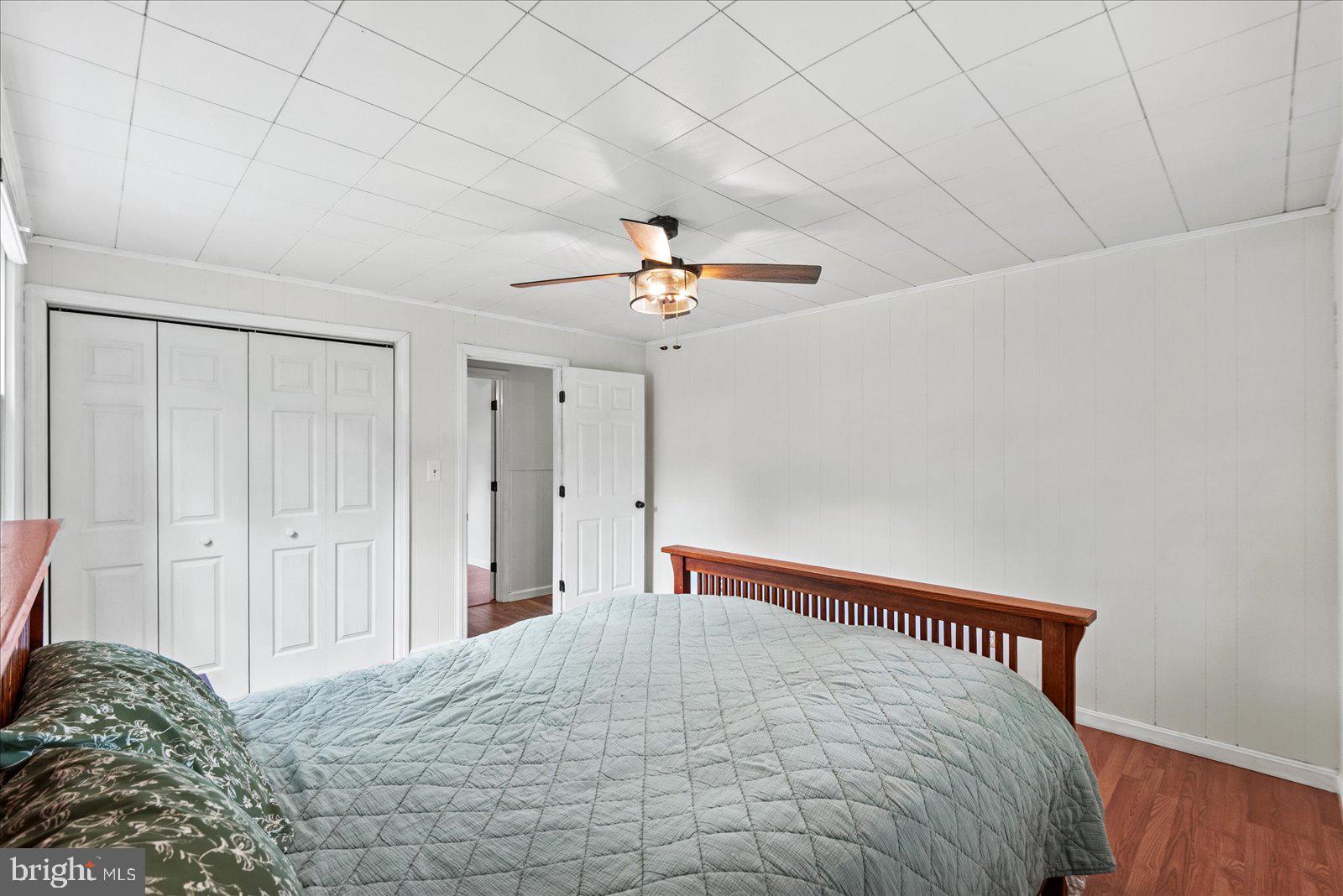 679 Resettlement Road Madison, VA 22727 - Photo 20 of 47 a bed room with a bed and a ceiling fan