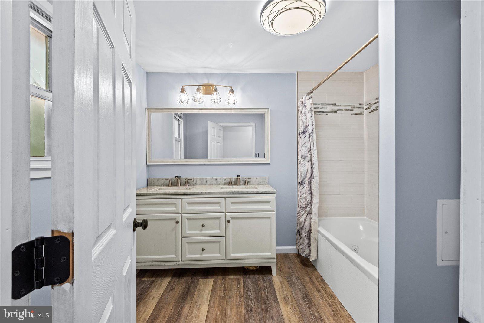 679 Resettlement Road Madison, VA 22727 - Photo 25 of 47 a bathroom with a sink a mirror and a shower