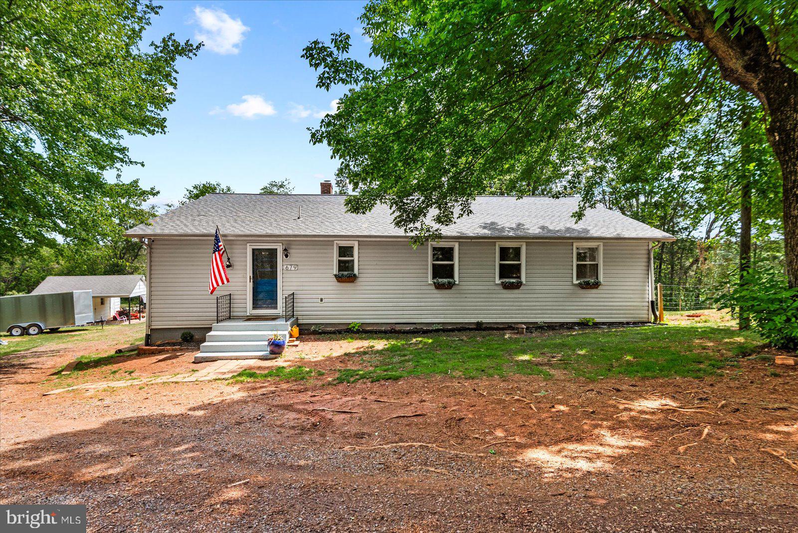 679 Resettlement Road Madison, VA 22727 - Photo 35 of 47 a view of a yard in front of a house with large tree