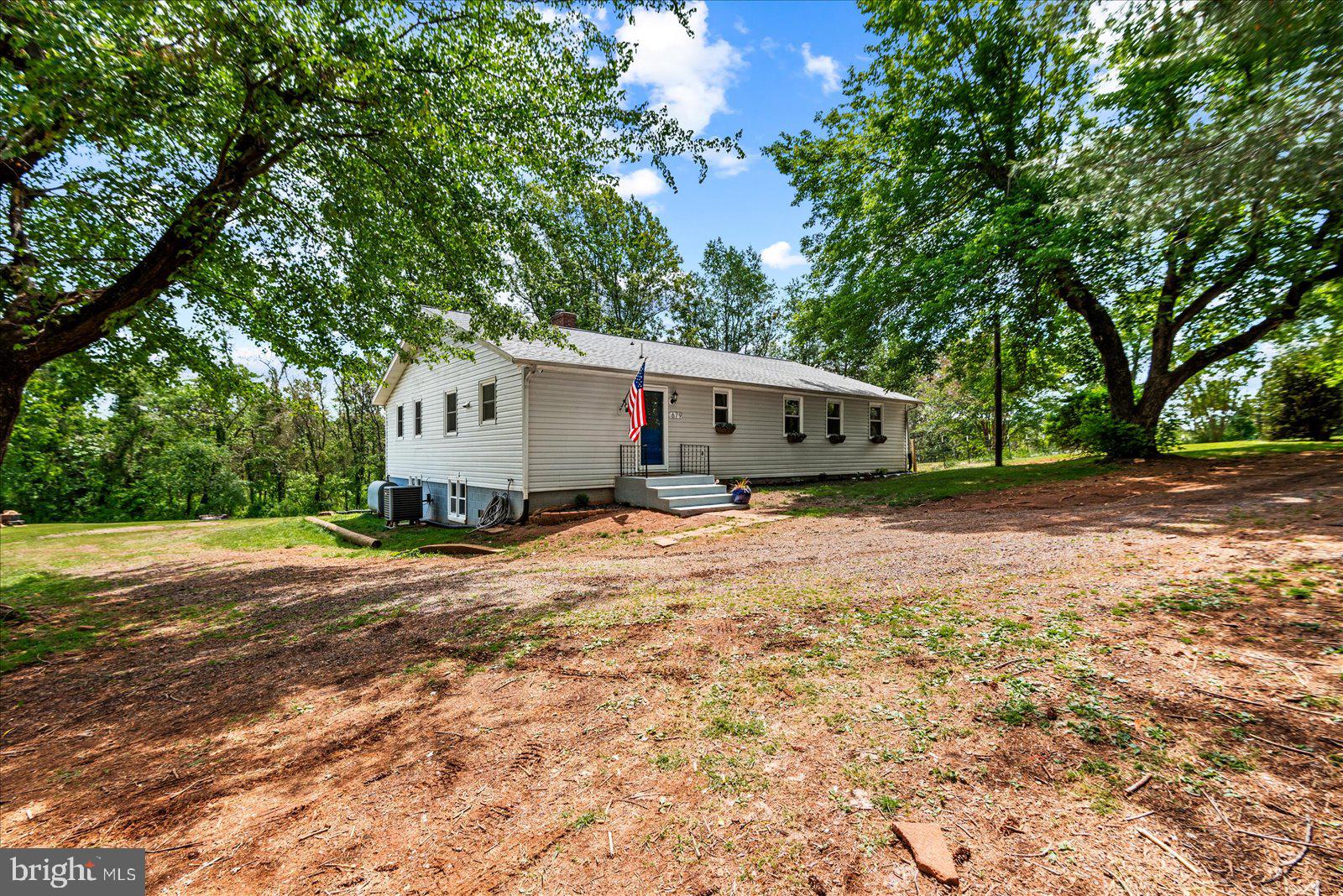 679 Resettlement Road Madison, VA 22727 - Photo 36 of 47 a view of house with backyard and trees