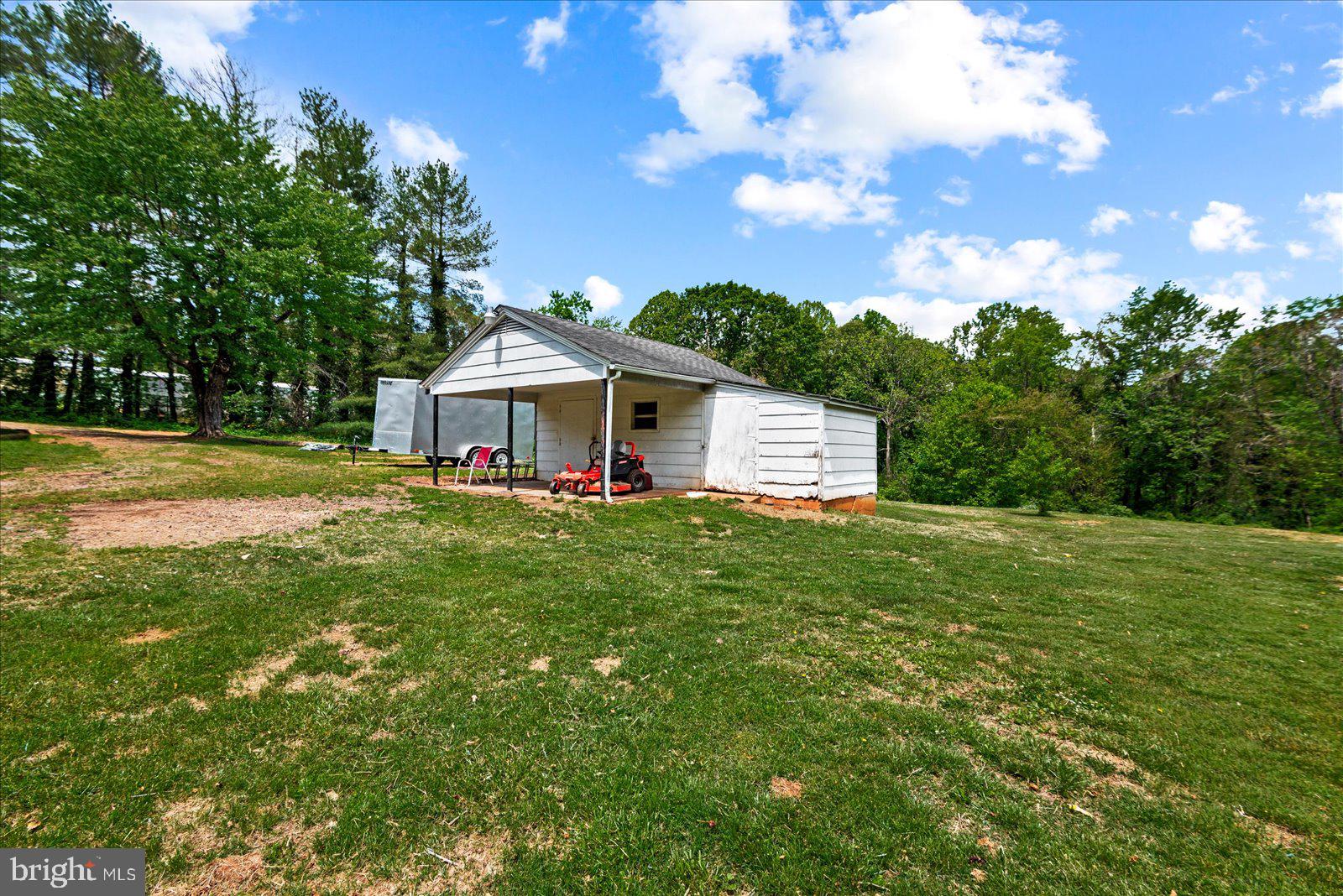 679 Resettlement Road Madison, VA 22727 - Photo 39 of 47 a view of a house with a yard and sitting area