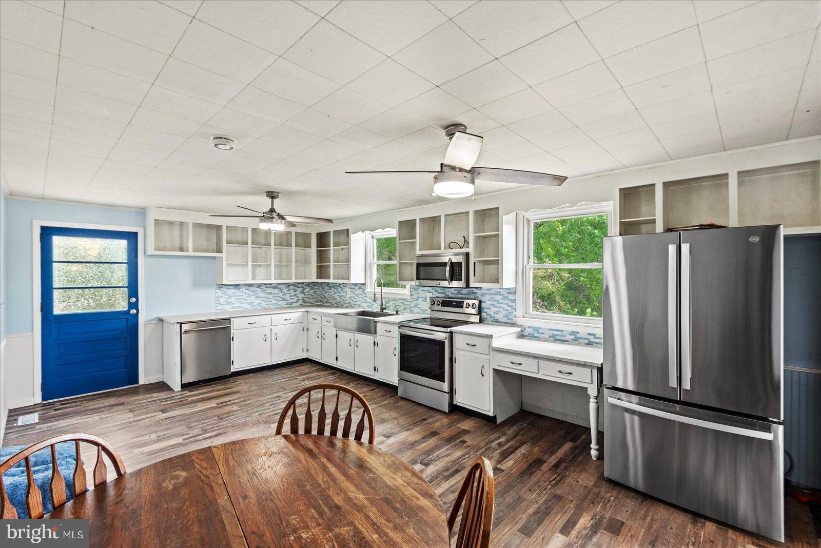 679 Resettlement Road Madison, VA 22727 - Photo 5 of 47 a kitchen with granite countertop stainless steel appliances a sink and counter space