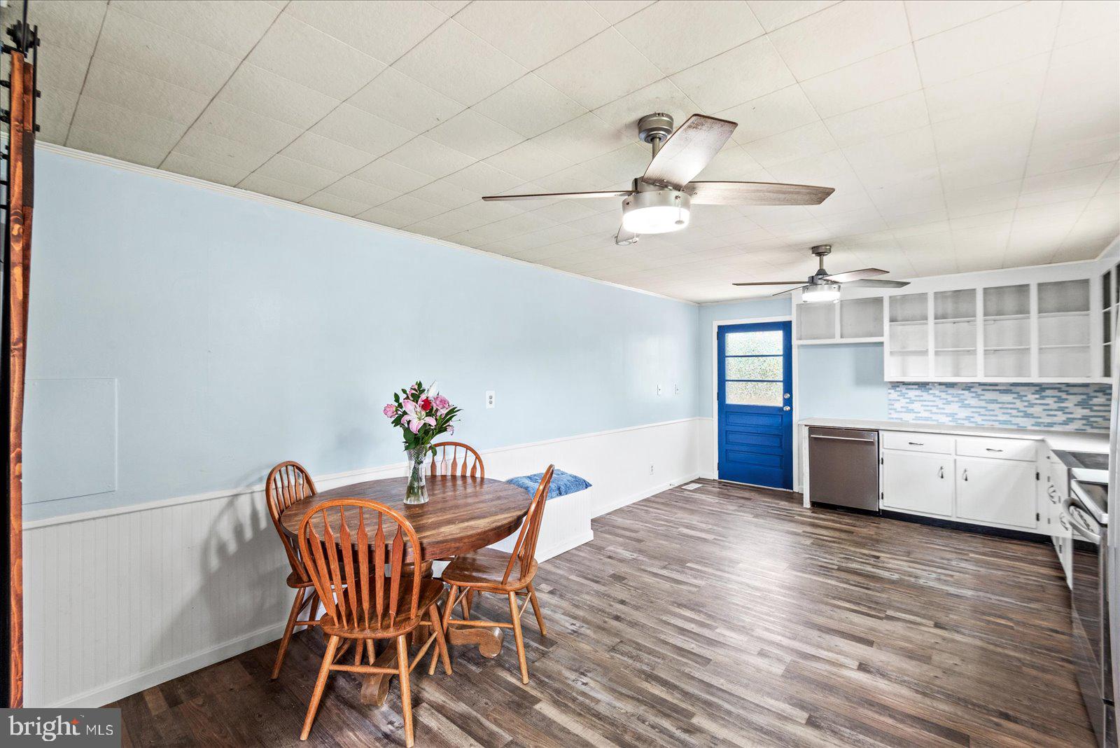 679 Resettlement Road Madison, VA 22727 - Photo 10 of 47 a view of a dining room with furniture and wooden floor