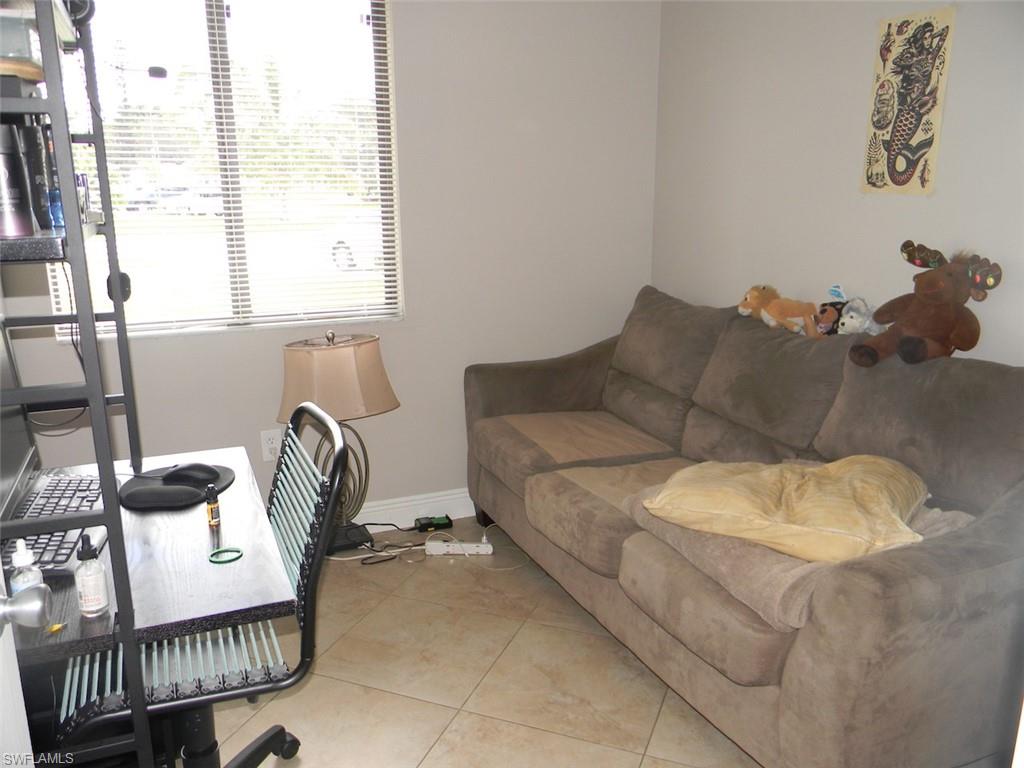 4448 30th Place Southwest Naples, FL 34116 - Photo 12 of 19 a living room with furniture