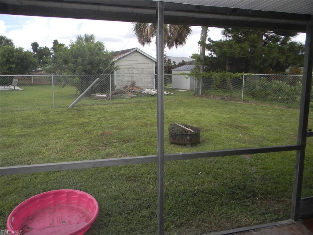4448 30th Place Southwest Naples, FL 34116 - Photo 15 of 19 a backyard of a house with lots of green space