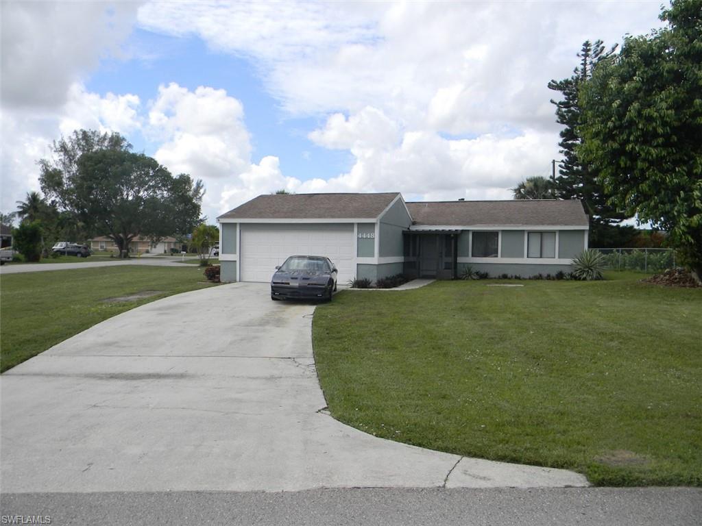 4448 30th Place Southwest Naples, FL 34116 - Photo 18 of 19 a house view with a garden space