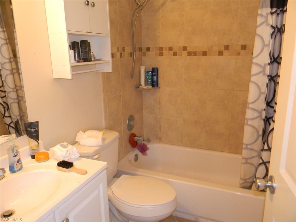 4448 30th Place Southwest Naples, FL 34116 - Photo 10 of 19 a bathroom with a sink toilet and shower
