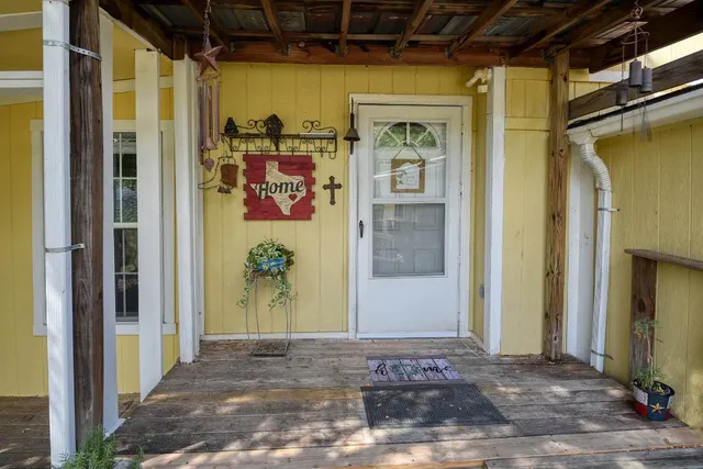 a living room with furniture a dining table and chairs
