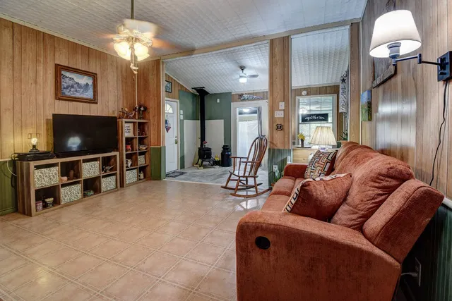 a kitchen with stainless steel appliances granite countertop a sink refrigerator and cabinets